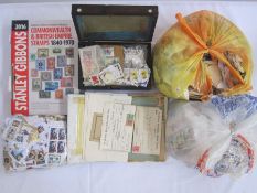 Box of loose stamps plus wooden box of stamps, a stockbook and an album of miscellaneous