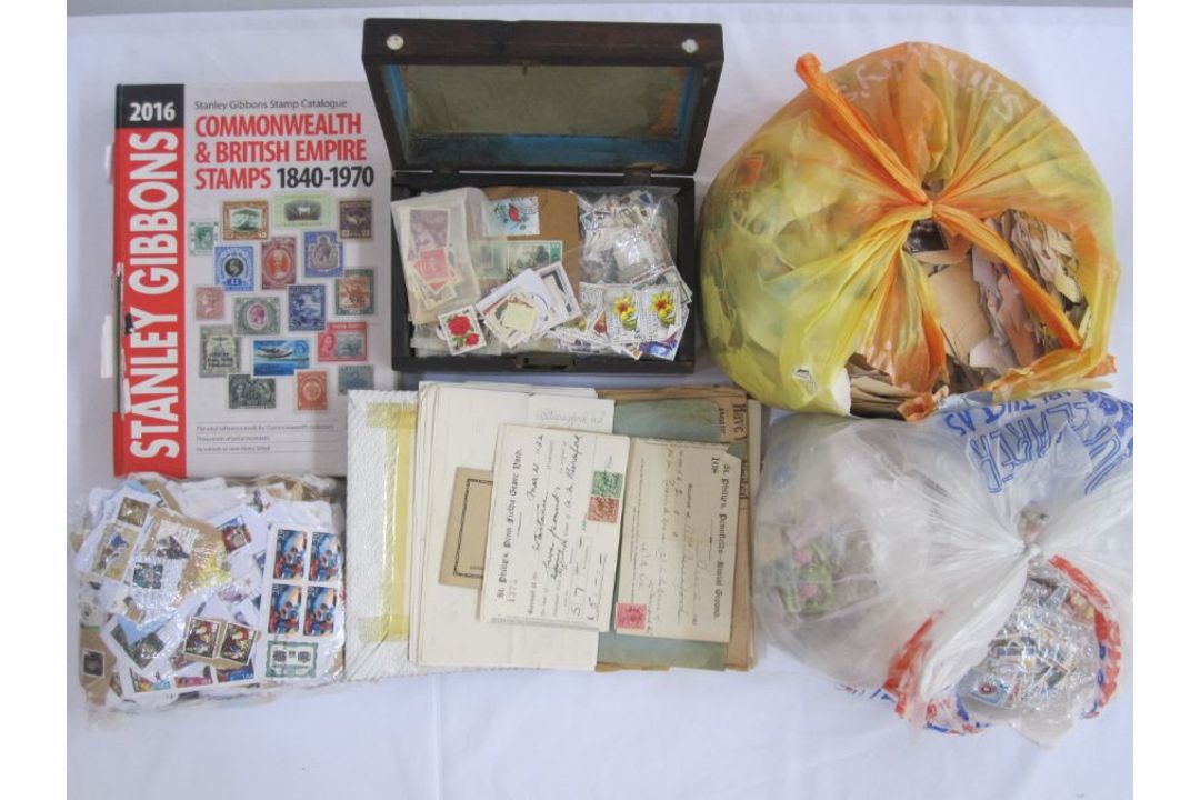 Box of loose stamps plus wooden box of stamps, a stockbook and an album of miscellaneous