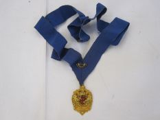 9ct gold medal with Gloucester City Coat of Arms, inscription on back 'PERCY DANIEL CLARKE, M.B.E