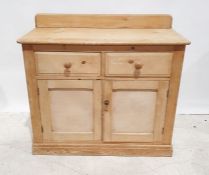 Early 20th century pine dresser, the rectangular top with rounded front corners, above two drawers