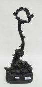 Victorian cast iron doorstop of scrolled form, 40cm tall