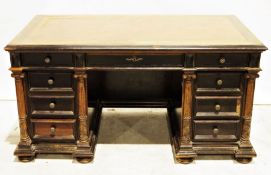 Late 19th century desk, the rectangular top with draw leaves to the sides, nine drawers with