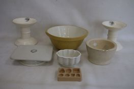 Two G Rushbrooke pottery ham stands, a stoneware mortar with glass pestle, a William Douglas &