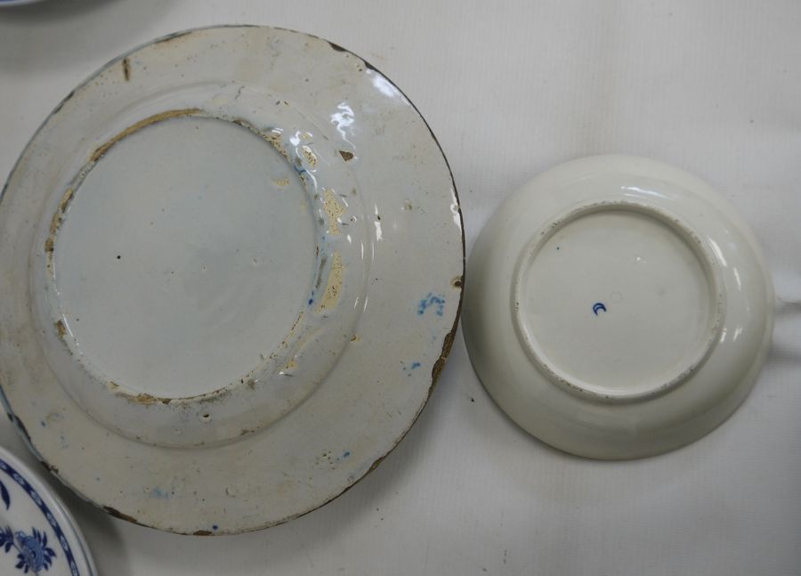 Two old Delft plates, blue and white decorated with floral and fence-pattern to the centre, stylised - Image 4 of 4