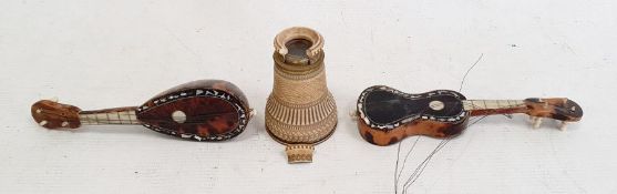 Miniature tortoiseshell guitar and a similar mandolin together with ivorine and brass mounted