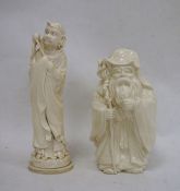 Japanese carved ivory model of a hooded man carrying fly whisk, signed to base, 22cm high and an