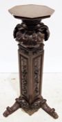 19th century mahogany stand, the octagonal top on heavily carved base, 118cm high