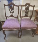 Pair of mahogany-framed bedroom chairs with purple upholstered overstuffed seats, cabriole front