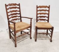 Set of five 20th century oak ladderback rush-seated chairs with turned stretchers (5)