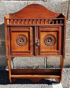 James Shoolbred of London wall-hanging cabinet, the arched back above spindle turned gallery, two