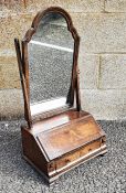 Early 18th century style walnut and banded dressing table mirror, the arched-top mirror on box