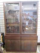 20th century Danish figured wood classic lounge unit with two glazed doors enclosing shelves, two