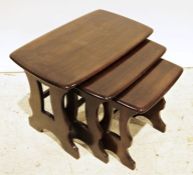 Nest of three 20th century dark stained Ercol coffee tables