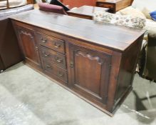 18th century oak low dresser, the rectangular top above three graduated short drawers flanked by