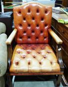 Buttonback office chair in red leather, moulded shew and mahogany frame