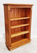 20th century pine open bookcase on plinth base, 91cm x 137cm