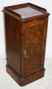 Late 19th century burr walnut pot cupboard with three-quarter galleried top above the moulded