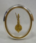 Jaeger Le Coultre mantel clock, the oval glass dial marked 'Jaeger Le Coultre', 16-jewels