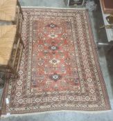 Red ground Eastern-style rug with stepped border 170cm x 127 cmCondition ReportExtra photos added