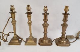 Two pairs of brass candlestick-style table lamps (4)