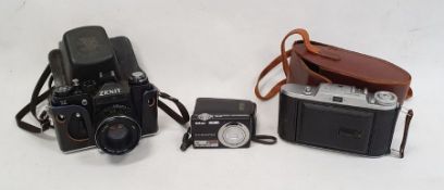 Voigtlander Bessa 1 folding camera, a Zenit 11 camera and other camera items