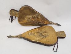 Two pairs of brass and oak bellows with embossed decoration featuring Charles the first and the