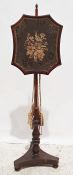 19th century mahogany framed polescreen with needlework floral spray, on turned support and