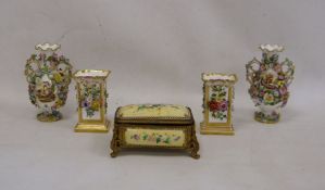 Pair of 19th century china floral encrusted vases, baluster-shaped with scrolled and looped handled,