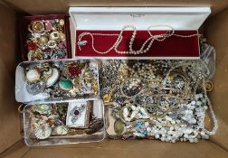 Quantity of costume jewellery to include brooches, clip-on earrings, beaded necklaces, etc (1 box)