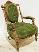 Late 19th century armchair, the shield-shaped back, seat and arms with green button-back upholstery,