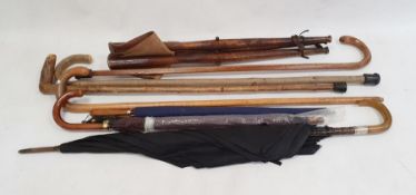 Shooting stick, quantity walking sticks and vintage umbrellas