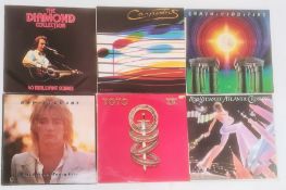 Approximately 100 vinyl records of various genres and artists including Rod Stewart, Cliff
