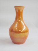 Moorcroft pottery vase with ovoid body and tall neck, orange lustre glaze, impressed mark to base,