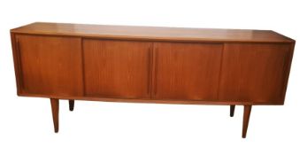 Mid 20th century Bramin  Danish teak sideboard with four sliding cupboard doors enclosing three