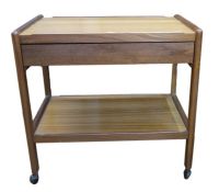 Mid 20th century two-tier trolley with frieze drawer, on castors, 68cm wide