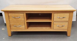 20th century oak coffee table, the rectangular top above drawers and over shelved undertier and an