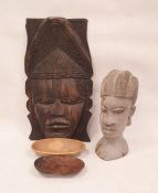 African carved hardwood mask depicting a woman with chip carved headdress, 48cm high, a carved