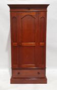 20th century mahogany single door wardrobe with moulded cornice above single panelled door, single