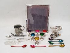 Silver-coloured metal rectangular picture frame, a collection of metal eggcups with coloured