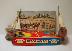 Two old painted wood red and green model pond yachts and two boxed games (1 box)