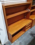 Mid century modern teak lounge unit with assorted shelves and drawer, on plinth base, 130cm x 140cm
