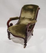 Late Victorian armchair with overscrolled arms, on turned front legs to brass castors, green