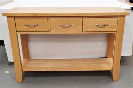 20th century oak hall table, the rectangular top above three drawers, over shelved undertier,
