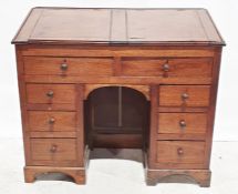 19th century mahogany clerk's kneehole desk, the top with two lift-up compartments above eight