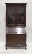 Early 20th century oak bureau bookcase with leaded glazed doors above fall and three drawers, on