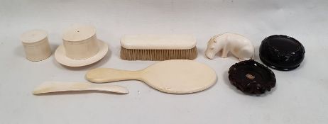 Bakelite dressing table box of circular form with internal floral decoration, a carved ivory model