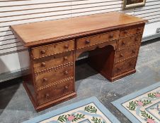 Victorian mahogany desk, the rectangular top with moulded edge, above nine assorted drawers, on