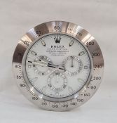 WITHDRAWN Modern wall clock in the form of a Rolex Oyster Perpetual Daytona wristwatch, 33cm