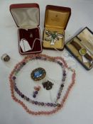 Silver and semi-precious stone ring, a small silver ingot pendant on chain, a Swedish silver foliate