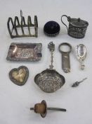 Silver four division toast rack, Birmingham 1933, a silver caddy spoon, a silver mounted circular